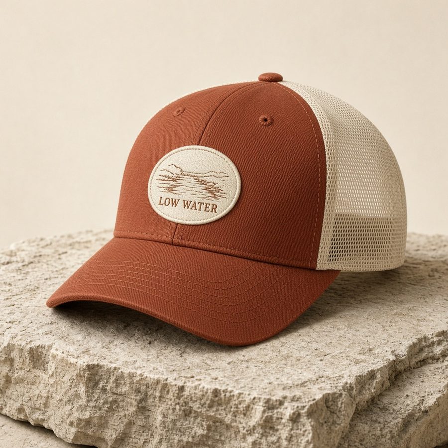 Rust and cream Low Water trucker cap with embroidered creek patch